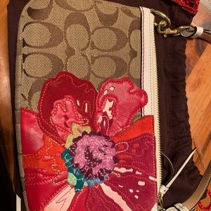 Authentic Coach handbag with leather appliqué